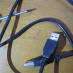 a screwdriver, the USB cable and a piece of wire